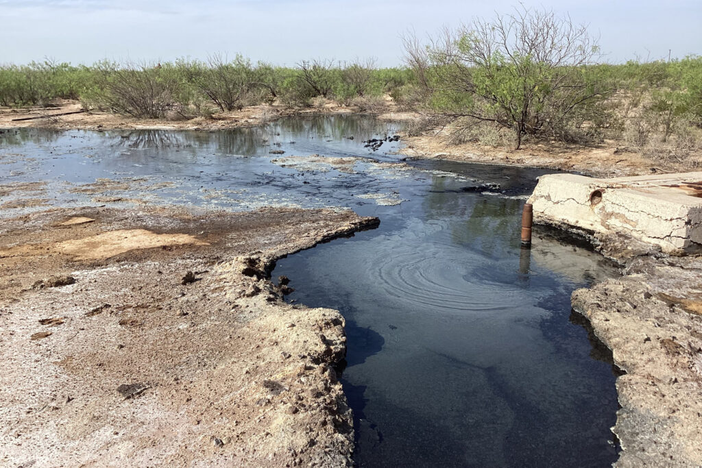 Water flows from an orphaned oil well on Schuyler Wight’s ranch in Pecos County, Texas. Credit: Courtesy of Schuyler Wight