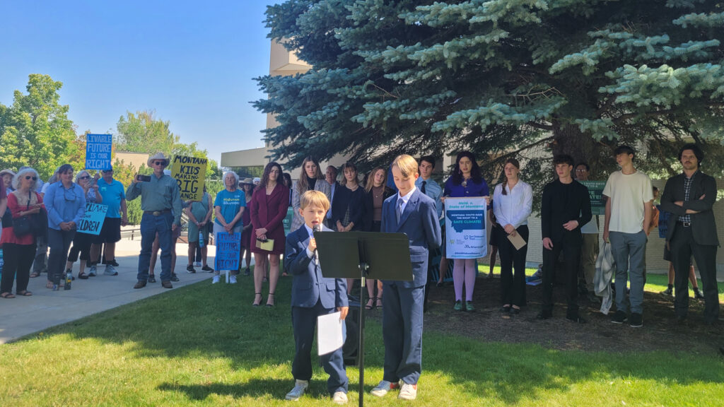 Nate King (aged 6) and Jeff King (aged 10), the youngest plaintiffs of the case, speak at a press conference held outside the Montana Supreme Court building in Helena on Wednesday. Credit: Najifa Farhat/Inside Climate News