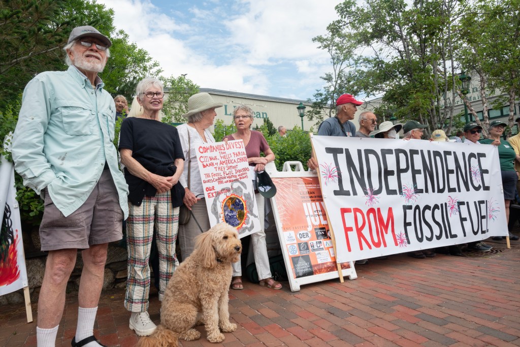 Freeport parade protestors call for fossil fuels divestment