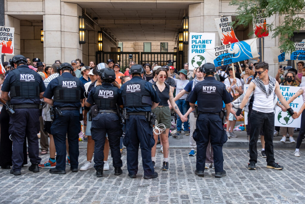 Since June, the Summer of Heat has organized more than 18 protests against Wall Street for its role in fueling climate change. In recent weeks, law enforcement has responded to some activists with more serious charges. Credit: Keerti Gopal/Inside Climate News