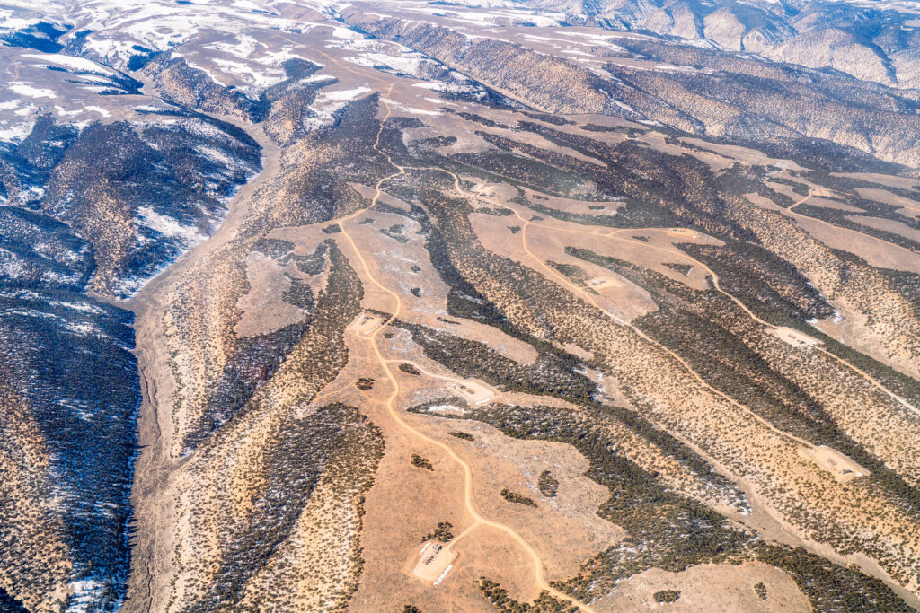 An aerial view of the Uinta Basin oil fields, where a proposed 88-mile railway would connect the oil production of northeastern Utah to the national rail network. Credit: EcoFlight