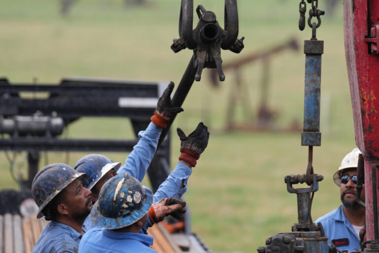 Employees of Bulldog Field Services work on plugging an orphan well for the Railroad Commission of Texas in Luling on March 27. Credit: Elizabeth Conley/Houston Chronicle via Getty Images