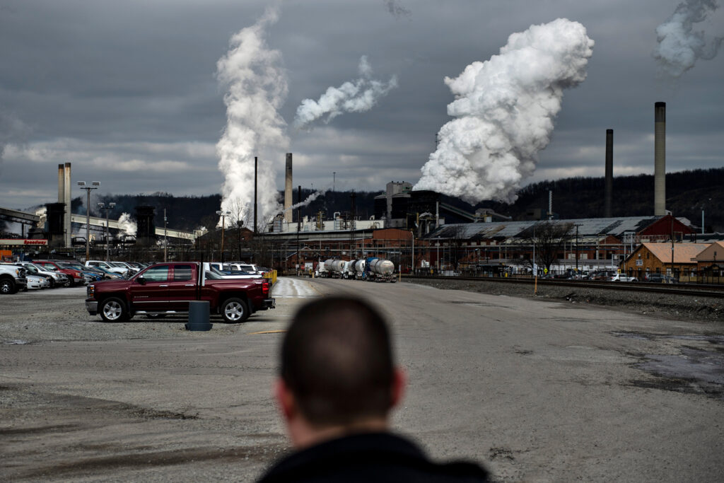 White plumes of smoke billow above U.S. Steel’s Clairton Coke Works in Clairton, Pa. Credit: Brendan Smialowski/AFP via Getty Images