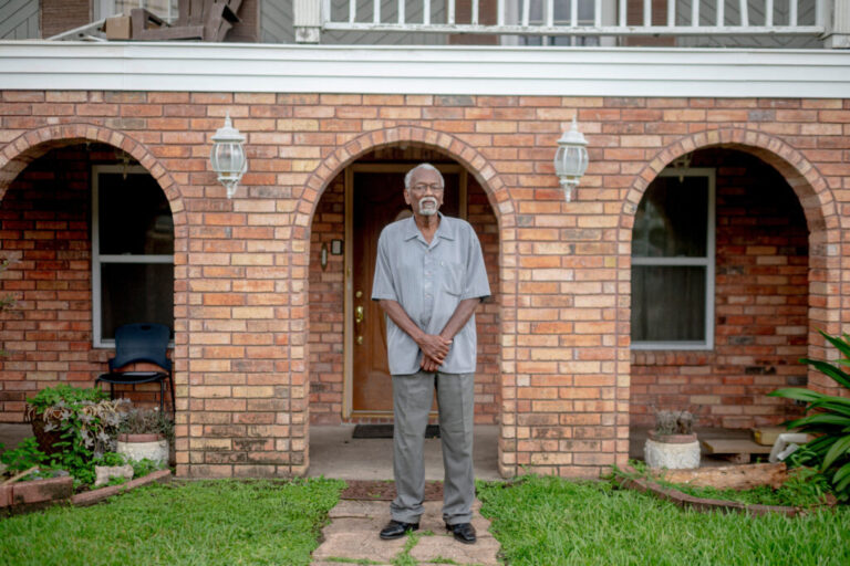 Robert Taylor, co-founder of Concerned Citizens of St. John, stands in front of his home in Reserve, La. Credit: Emily Kask/AFP via Getty Images