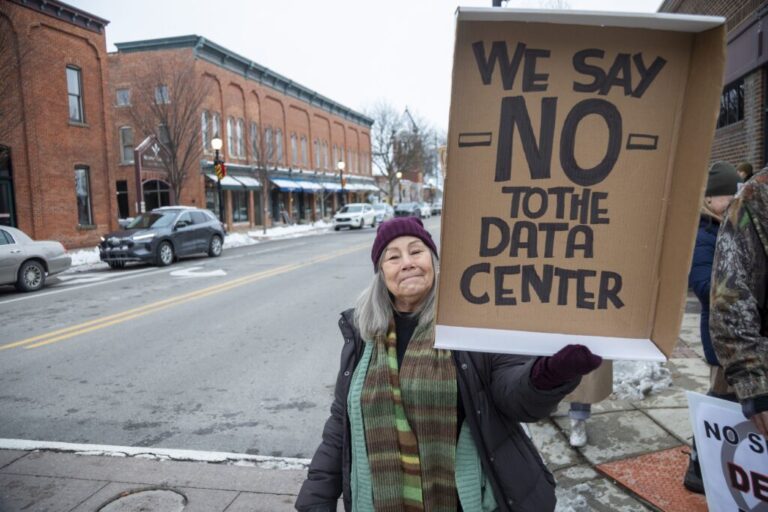 Rural Michigan residents rally this month against the $7 billion Stargate data center planned on southeast Michigan farm land in Saline. Credit: Jim West/UCG/Universal Images Group via Getty Images