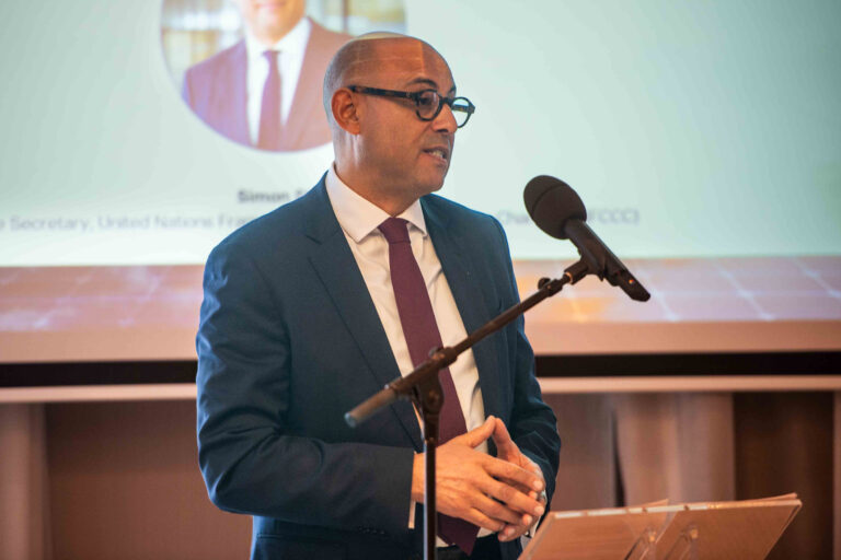 Simon Stiell, executive secretary of the U.N. Framework Convention on Climate Change, speaks during the Green Growth Summit in Brussels on Monday. Credit: Michael Chia/UNFCCC
