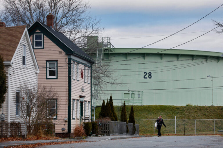 Petroleum storage tanks reside next to the Ferry Village neighborhood near the South Portland waterfront. Credit: Derek Davis/Portland Portland Press Herald via Getty Images