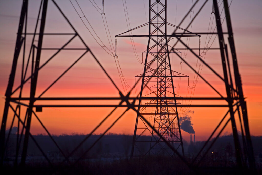 Transmission lines lead away from a coal-fired power plant in China Township, Mich. Credit: Jim West/UCG/Universal Images Group via Getty Images