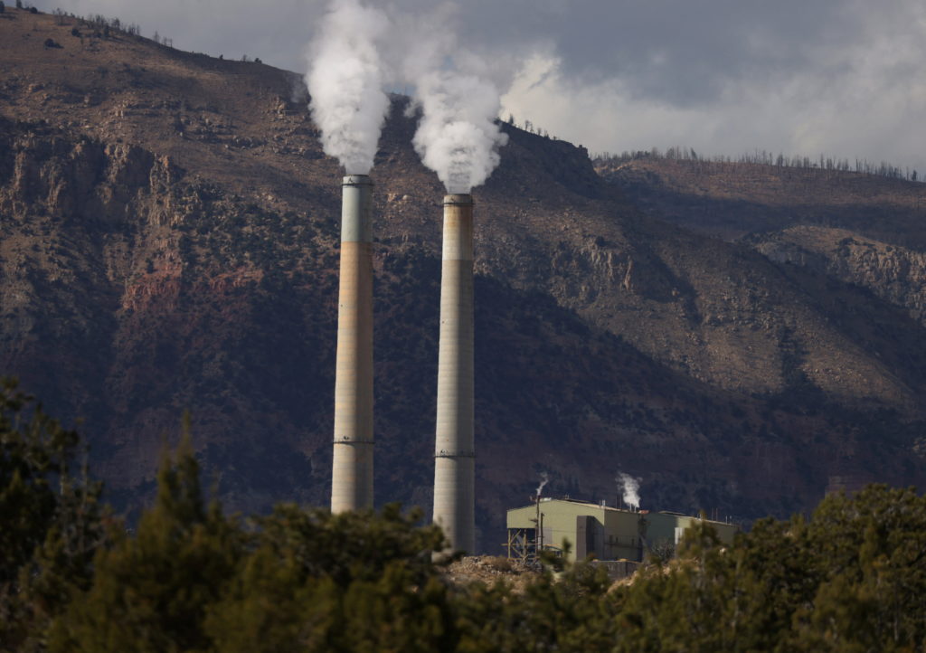 Fumes rise from the coal-fired Huntington Power Plant in Huntington