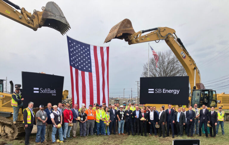 Officials and local workers pose for photos following the ceremonial groundbreaking for SoftBank’s PORTS Technology Campus near Piketon, Ohio. Credit: Dan Gearino/Inside Climate News