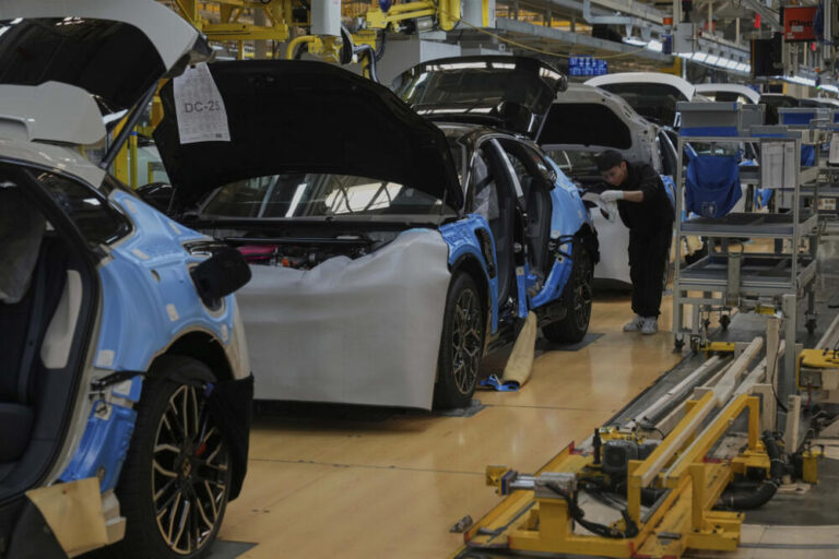 A worker assembles the Zeekr 001 EV model at the Chinese automaker Zeekr assembly plant, in Ningbo, east China