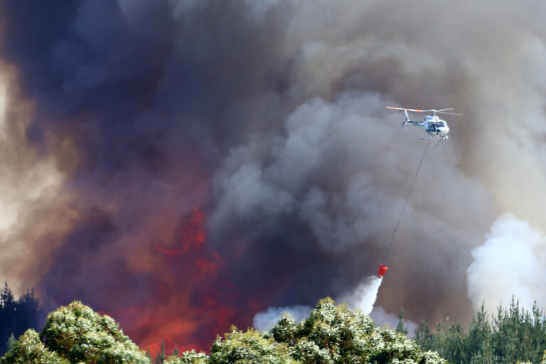 Helicopters dump water to fight a wildfire on Feb. 7, 2019, near Nelson, New Zealand. Credit: Evan Barnes/Getty Images