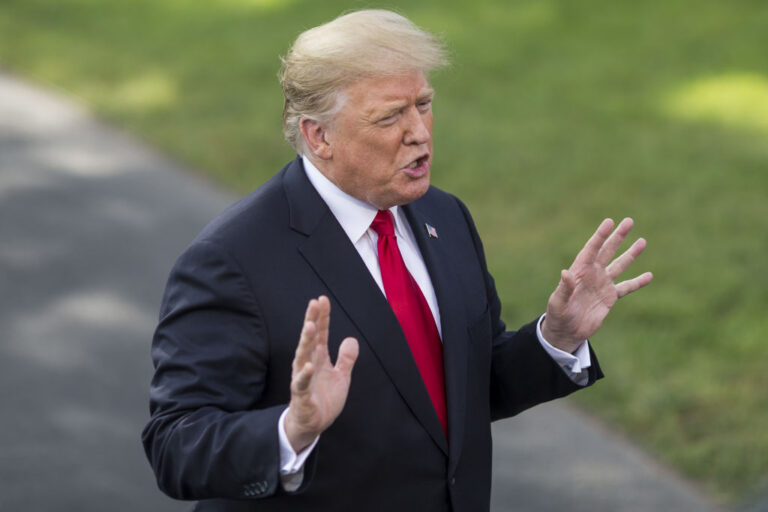 Donald Trump speaks to members of the media before boarding Marine One in Washington, DC, on October 9, 2018.