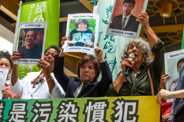 Diane Wilson (right), Sharon Lavigne (left) and Nancy Bui display pictures of Vietnamese activists jailed for demanding reparations over the Formosa Plastics’ 2016 chemical spill disaster on May 28 in Taipei. Credit: Dylan Baddour/Inside Climate News