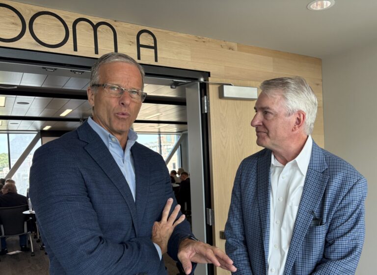 U.S. Senate Majority Leader John Thune, R-South Dakota, speaks with Northwestern Energy President and CEO Brian Bird in Sioux Falls on Aug. 18, 2026. (Photo by Joshua Haiar/South Dakota Searchlight)