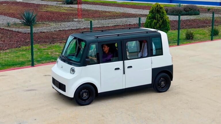 Mexican President Claudia Sheinbaum at the wheel of the Olinia at its roll-out in June.