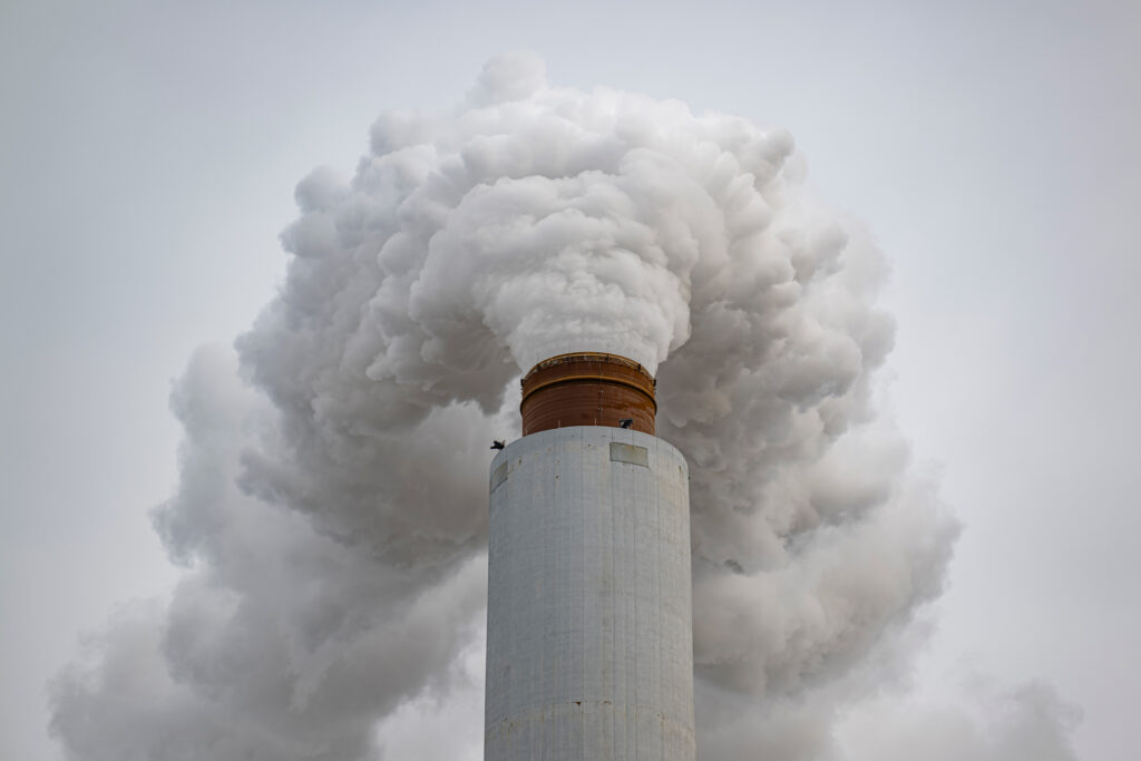 A flue-gas stack blows exhaust at a coal-fired power plant in Ghent, Ky., on Feb. 14. Credit: Jon Cherry/Getty Images
