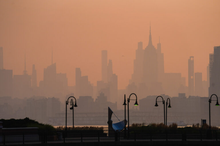 The New York City skyline is seen through a cover of wildfire smoke, in Jersey City, N.J., Friday, July 17, 2026. (AP Photo/Ryan Murphy)