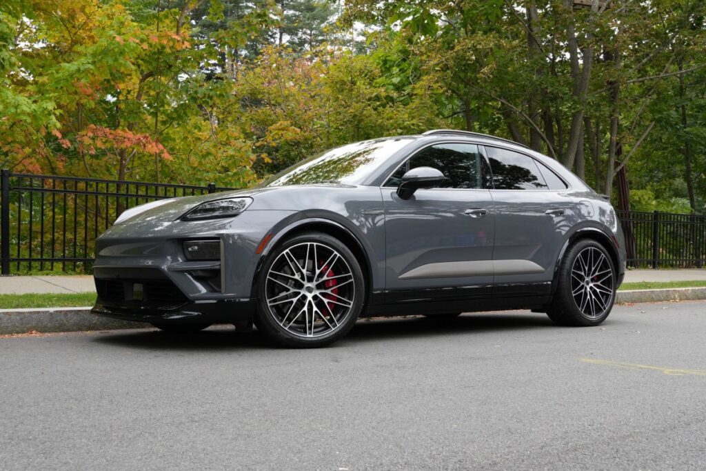 A Porsche Macan Turbo sits parked on the street.