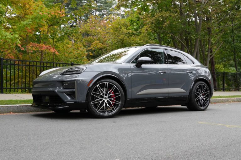 A Porsche Macan Turbo sits parked on the street.